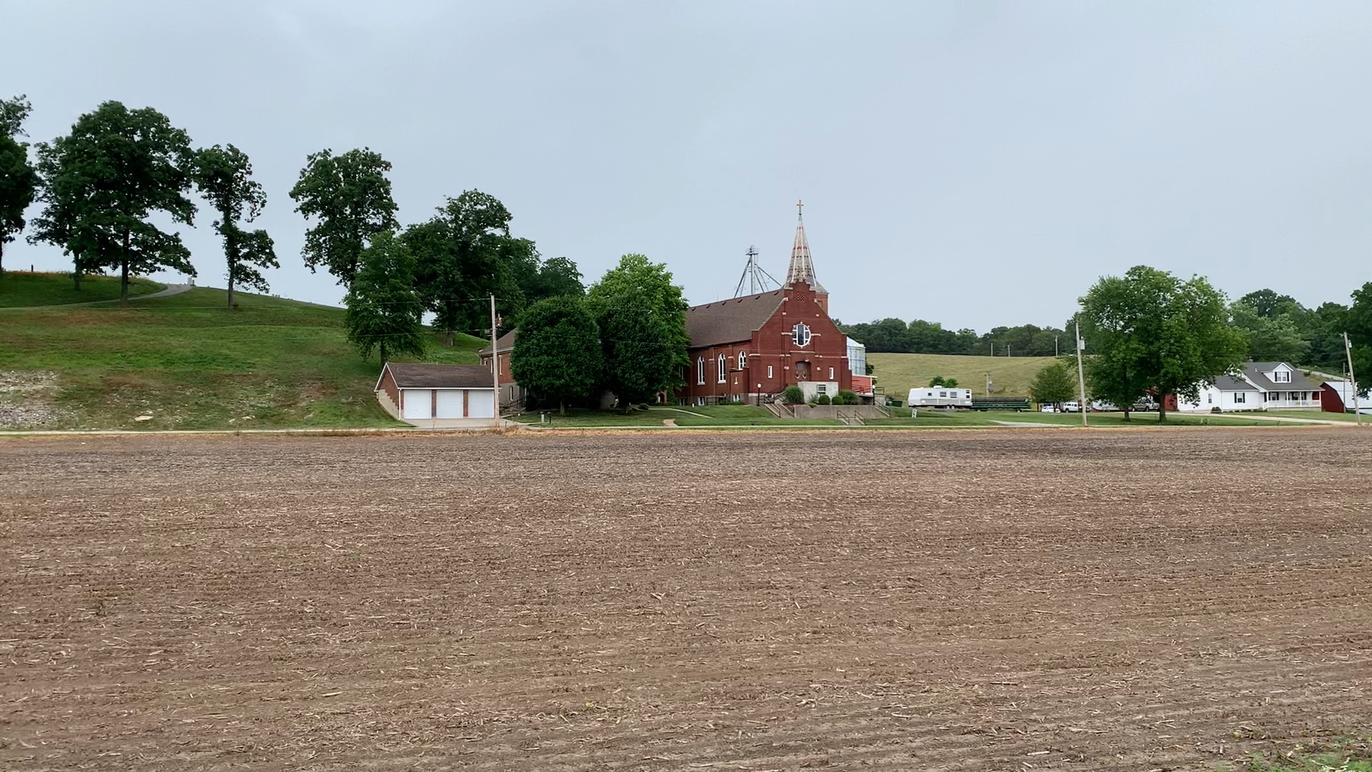Scenic view of church and farmland